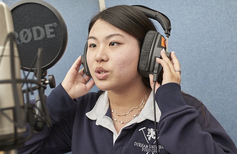 A student practicing in the studio