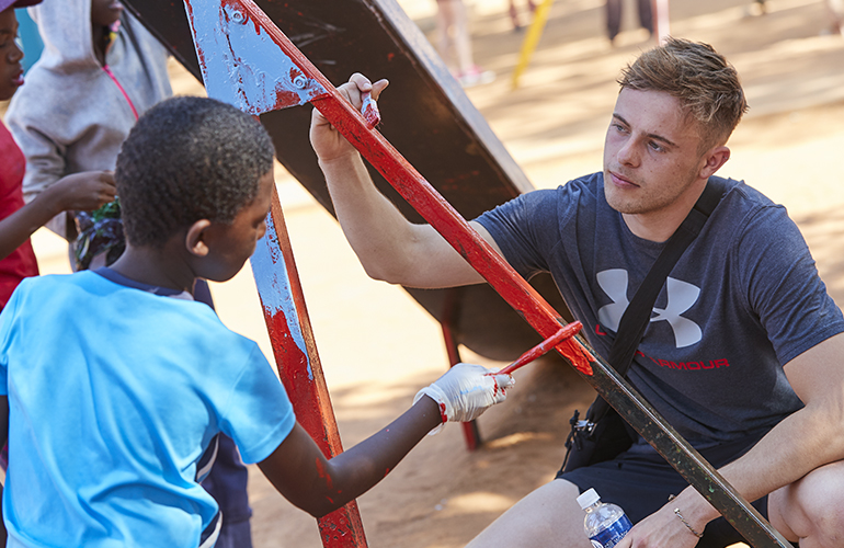 Students help refurbish the playground at the SOS Children's Village, Gaborone, Botswana